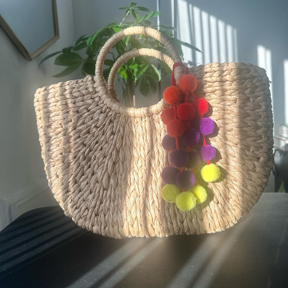 Stylish Tan Woven Bag with Colorful Pom-Poms